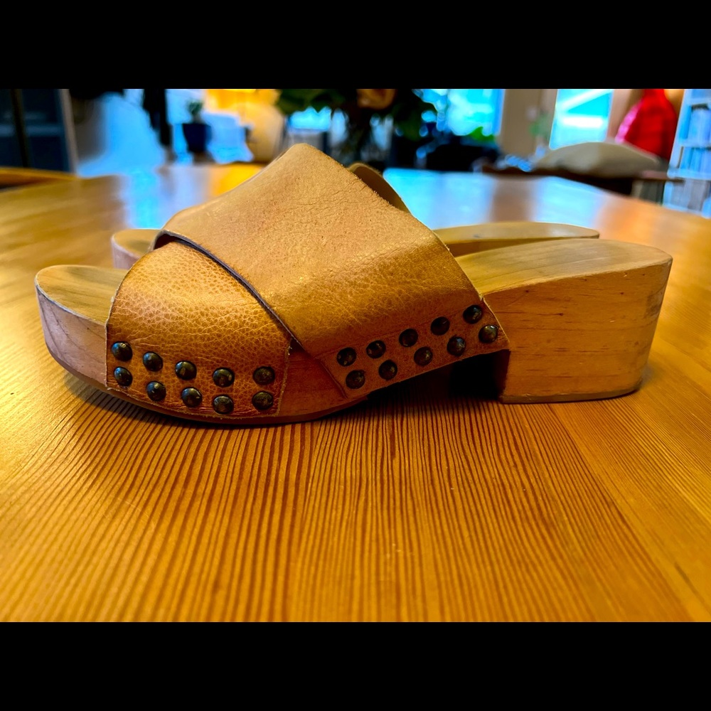 Leather and wood platform slides.